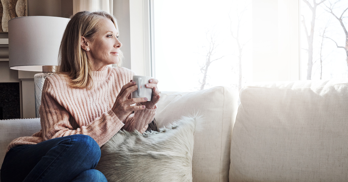 Woman Sitting Down Contemplating Winter Stress Reduction Techniques